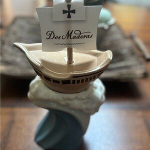 mug by Dos Maderas in 2 parts, the mug like a cresting wave and a ship on top.